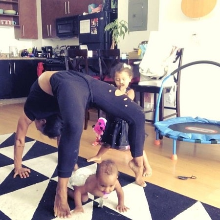 A picture of Amina Buddafly working out with her daughters.